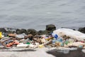 plastic trash garbage on the bay walk polluting the ocean and en Royalty Free Stock Photo