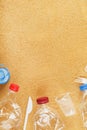 Plastic trash on a sandy beach with Trash from plastic bottles on a sandy beach with free space. Royalty Free Stock Photo