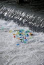 Plastic trash trapped at waterfall