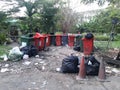 Plastic trashcan With garbage in garden public park