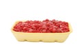 Plastic tray with the frozen raspberry