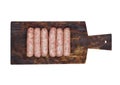 Plastic tray of raw pork beef sausages on wood Royalty Free Stock Photo