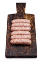 Plastic tray of raw pork beef sausages on wood Royalty Free Stock Photo