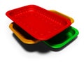 Plastic trays of different colors 3d render on white background with shadow