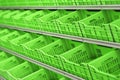 Plastic vegetable and fruit crates in a row on supermarket shelves
