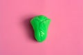 Plastic vegetable lettuce isolated on pink background