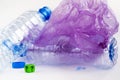 Plastic waste: bottles, polyethylene bags, dice with a question mark.