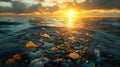Plastic waste floating on the surface of the ocean during a colorful sunset with visible debris Royalty Free Stock Photo