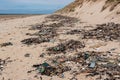 Plastic waste washed up on a beach. Royalty Free Stock Photo