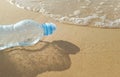 Plastic water bottles pollution in ocean on the shore, Royalty Free Stock Photo