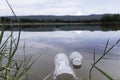 Plastic water bottles pollution in the river. Plastic trash in water. Environmental pollution concept Royalty Free Stock Photo