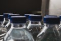 Plastic water bottles. View of the blue cap. Royalty Free Stock Photo