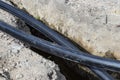 Plastic water pipe lying along the ditch with high groundwater, water connection in the housing estate.