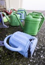 Plastic watering cans Royalty Free Stock Photo