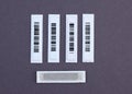 Plastic White Barcode Soft Tags on gray background. Royalty Free Stock Photo