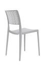 Plastic white chair with a wicker back. Patio or cafe furniture. Royalty Free Stock Photo