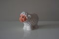 Plastic white lamb on white shelf Royalty Free Stock Photo