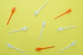 Plastic forks on yellow background Royalty Free Stock Photo