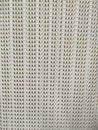 Plastic white wicker texture on laundry basket as clothing container, closeup on the pattern Royalty Free Stock Photo