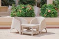 Plastic wicker garden furniture set. A table and two armchairs made of wicker plastic Royalty Free Stock Photo