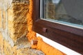 Plastic window is installed with mounting foam