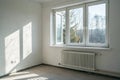 Plastic window and radiator in a light empty room Royalty Free Stock Photo
