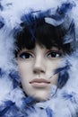 Mannequin with black hair wearing a hoodie with white and blue feathers Royalty Free Stock Photo