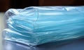 Plastic wrap roll, food wrap, or pliofilm is a thin plastic film typically used for sealing food items in containers to Royalty Free Stock Photo