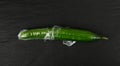 Plastic Wrapped Cucumber, Vegetable in Film Packaging, Film Wrap Food, Eat Plastic Concept Royalty Free Stock Photo