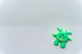 Plasticine 3D UFO, spaceship sculpture, cute green alien on white background