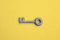 Plasticine key on yellow background. Safety, protection concept, internet password, security concept. Access or privacy symbol Royalty Free Stock Photo