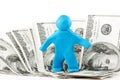 Plasticine man with banknote Royalty Free Stock Photo