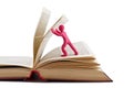 Plasticine man leafing through a book Royalty Free Stock Photo