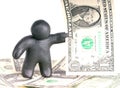 Plasticine man with one dollar banknote Royalty Free Stock Photo