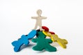 A plasticine man standing on top of other plasticine men. Leadership concept. Conceptual image of teamwork on white Royalty Free Stock Photo