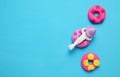 Plasticine people relaxing on inflatable donut lilo in pool. Cartoon summer relaxing and holidays