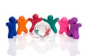 Plasticine people surrounding a crystal globe Royalty Free Stock Photo