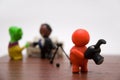 Plasticine person with businessman and alien