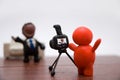 Plasticine photographer with businessman