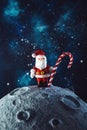 Plasticine Santa Claus with a lollipop on the moon