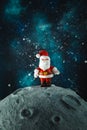 Plasticine Santa Claus on the moon. Christmas card