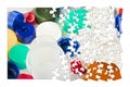Plastics recycling concept image in jigsaw puzzle shape