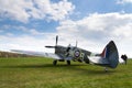 Pilot sits in cockpit of Supermarine Spitfire fighter aircraft