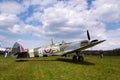 Pilot sits in cockpit of Supermarine Spitfire fighter aircraft