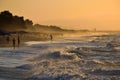 Wave breaks during the storm at sunset Royalty Free Stock Photo