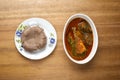 A plate of amala served with ewedu,gbegiri, titus fish and pieces of beef