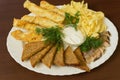 Plate with appetizers, herring. Snacks on a plate.