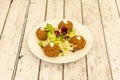 Plate of arabic falafel with mayonnaise and salad