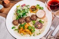 Plate of arabic kebab meat with grilled vegetables