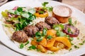 Plate of arabic kebab meat with grilled vegetables